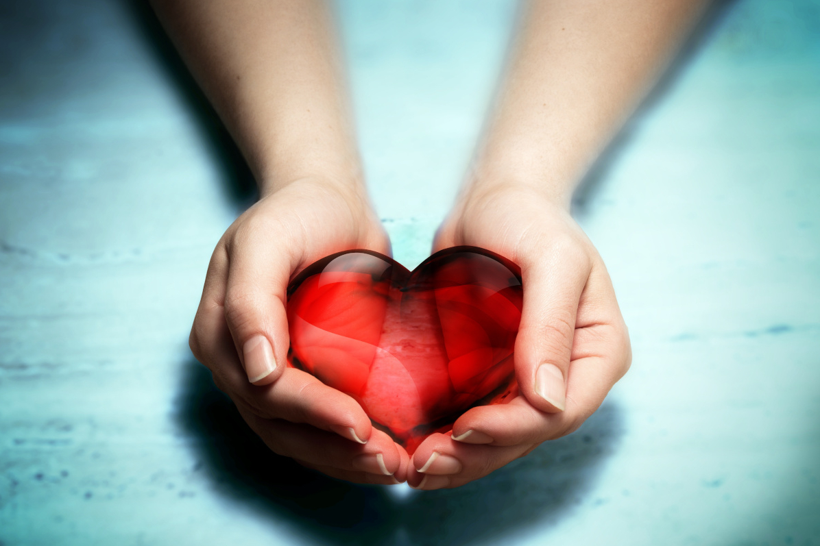 Person holding a diamond hart